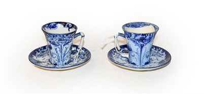 Lot 308 - Two William Moorcroft Florian ware blue and white cups and saucers