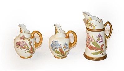 Lot 312 - Three Royal Worcester blush ivory jugs, two shape number 1094, 14cm, the other 18cm, (3)