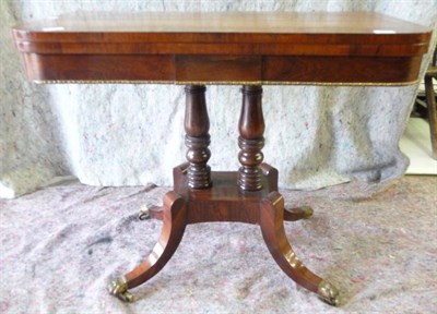 Lot 1537 - A Regency Rosewood, Satinwood Banded and Gilt Metal Foldover Card Table, circa 1820, the hinged lid