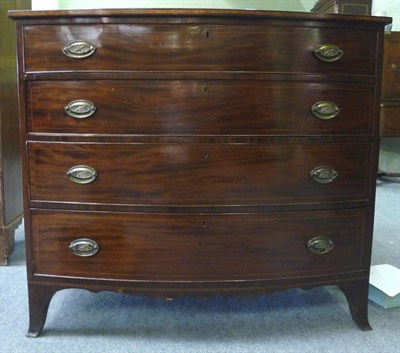 Lot 1538 - A Late George III Mahogany and Herringbone Inlaid Bowfront Chest, early 19th century, with four...