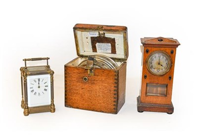 Lot 332 - A pigeon timing clock, compass, Art Nouveau mantel timepiece, and a brass carriage timepiece