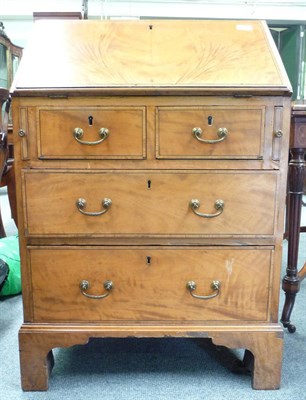 Lot 1539 - A George III Style Satinwood and Tulipwood Banded Bureau, the fall enclosing a worn green...