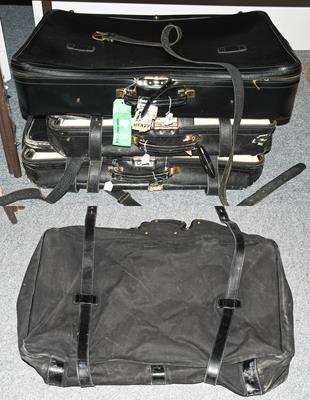 Lot 390 - Two graduated black Tanner Krolle suitcases made for Harrods, the largest with canvas protector and