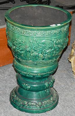 Lot 396 - An early 20th century Chinese green glazed jardiniere on stand decorated with dragons, 45cm...