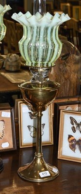 Lot 412 - A Victorian brass oil lamp with a vaseline shade, 66cm overall including funnel