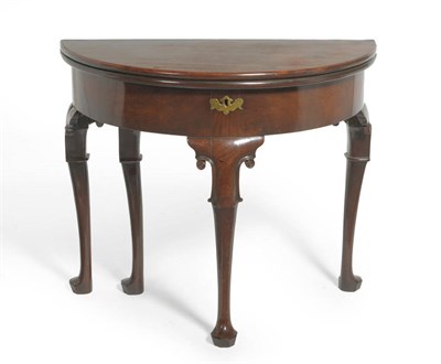 Lot 1549 - A George II Mahogany Demi-Lune Foldover Tea Table, mid 18th century, the plain frieze above...