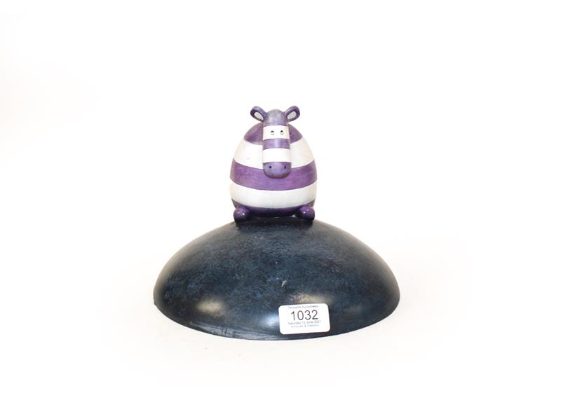 Lot 1032 - P.S (Contemporary) Striped cow on a hill Signed and numbered 17/495, cold cast ceramic, 20cm high