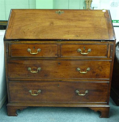 Lot 1562 - A George III Mahogany Bureau, late 18th century, the fall enclosing a fitted interior of twenty...