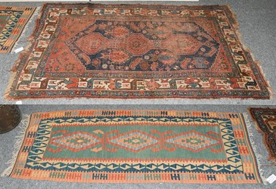 Lot 1203 - A Bidjar rug, the indigo field of tribal motifs around a madder panel framed by borders of...