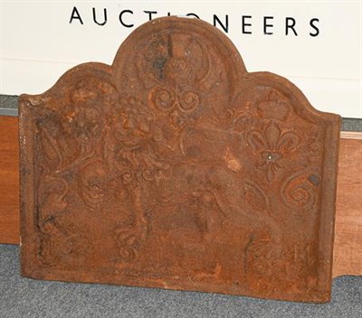 Lot 1231 - A cast iron metal fire back decorated with a lion and thistle in relief