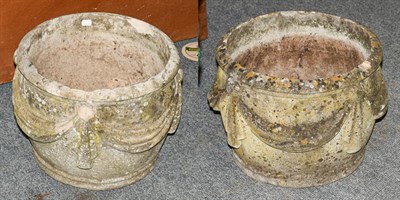Lot 1235 - A pair of weathered garden planters ornamented with linen swags, diameter 40cm, 30cm high (2)