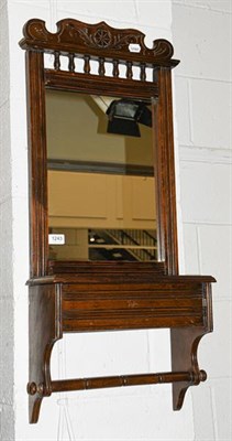 Lot 1243 - An early 20th century mahogany hall mirror with integral glove box, 42cm by 17cm by 90cm