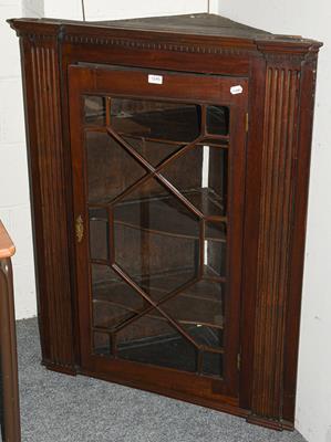Lot 1245 - A 19th century glazed mahogany hanging corner cupboard bearing label J.Morris & Son, Wolverhampton
