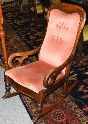 Lot 1257 - A late Victorian mahogany framed rocking chair with pink buttoned upholstery