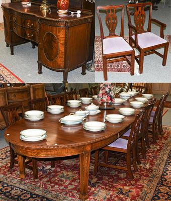 Lot 1261 - A Victorian style dining suite comprising a mahogany 14ft draw leaf dining table with four...
