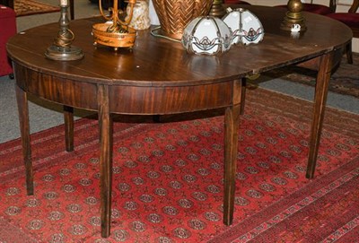 Lot 1266 - A pair of George III mahogany D-end tables each on tapering square section legs with central...