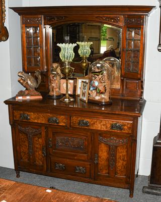 Lot 1280 - An early 20th century Arts & Crafts oak and walnut mirror-back sideboard, 142cm by 56cm by 188cm
