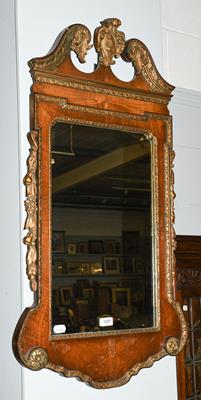 Lot 1281 - A Georgian style reproduction parcel gilt walnut pier glass, 55cm by 100cm