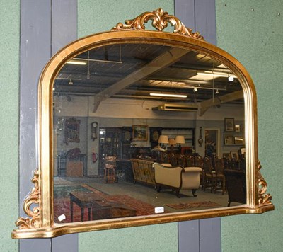 Lot 1283 - A reproduction gilt framed overmantel mirror, 121cm by 90cm