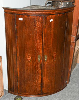 Lot 1291 - An 18th century inlaid bow fronted mahogany corner cupboard, 74cm by 49cm by 101cm