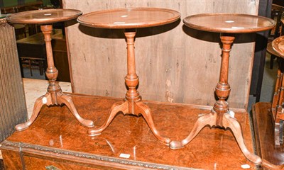 Lot 1294 - A pair of 20th century mahogany dish topped circular wine tables, 33cm diameter by 51cm high,...