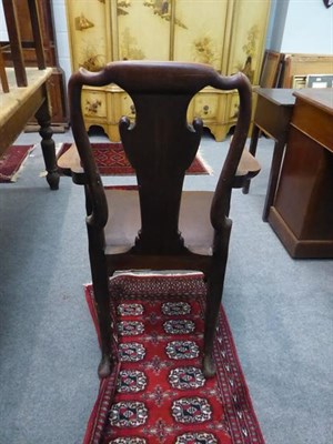 Lot 1299 - A 19th century style mahogany open armchair on shell carved legs and pad feet