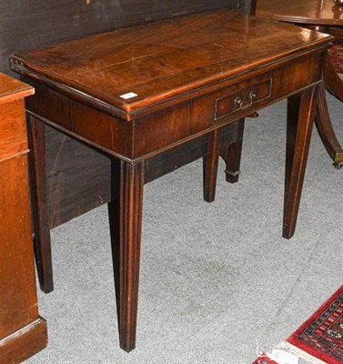 Lot 1301 - A George III mahogany fold-over tea table, 90cm by 43cm by 74cm