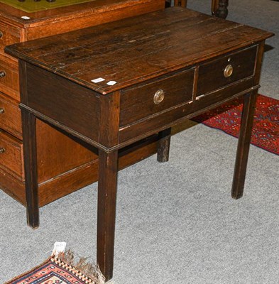 Lot 1302 - An 18th century oak side table, fitted with two drawers, 87cm by 47cm by 71cm