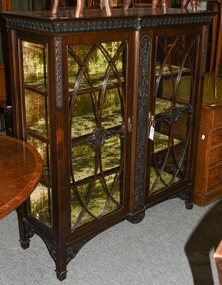 Lot 1308 - An Edwardian glazed mahogany display cabinet, 121cm by 48cm by 136cm