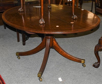 Lot 1310 - A 19th century inlaid mahogany oval tilt top breakfast table, 145cm by 120cm by 71cm