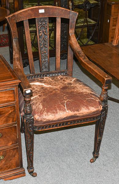 Lot 1313 - An early 20th century oak judges chair