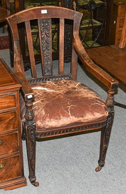 Lot 1313 - An early 20th century oak judges chair
