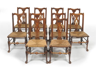 Lot 1581 - A Set of Ten 19th Century Ash and Rush Seated Chairs, probably North West, the shaped top rail...