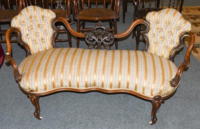 Lot 1330 - A Victorian carved walnut framed open sofa upholstered in striped fabric, 155cm long
