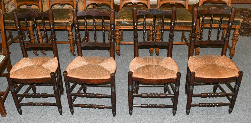 Lot 1335 - A set of four rush seated country chairs