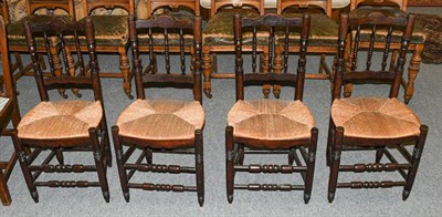 Lot 1335 - A set of four rush seated country chairs
