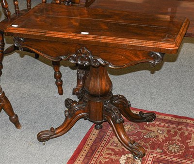 Lot 1340 - A Victorian rosewood fold-over pedestal tea table, 91cm by 44cm by 72cm