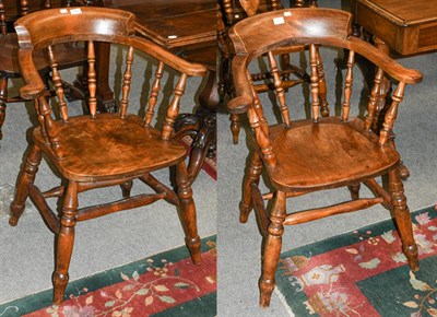 Lot 1341 - A pair of 19th century yew wood smokers chairs with twin stretchers and turned supports (2)