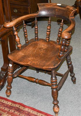 Lot 1350 - A 19th century elm Captain's arm chair