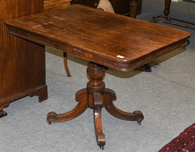 Lot 1351 - A mahogany flip-top pedestal table, 2nd quarter 19th century, of rounded rectangular form with...
