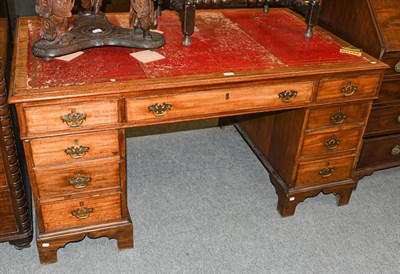 Lot 1355 - A late 19th/early 20th century red leather inset mahogany pedestal partners desk, 152cm by 92cm...