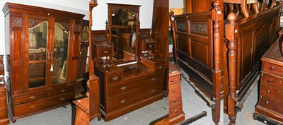 Lot 1368 - An Edwardian three piece mahogany bedroom suite comprising: a mirrored double wardrobe, 161cm...