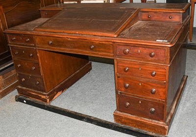 Lot 1369 - A leather top desk with bureau top, 152cm by 80cm by 84cm