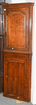 Lot 1374 - Two George III oak hanging corner cupboards