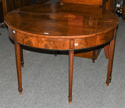 Lot 1391 - A pair of George III inlaid mahogany D-end tables, with ebonised mouldings, each 120cm by 60cm...