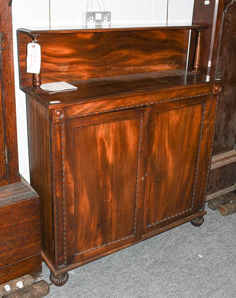 Lot 1397 - An early 19th century chiffonier, the gallery back, turned spindle supports and moulded edge...