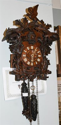 Lot 1401 - A Black Forest Cuckoo clock including two weights