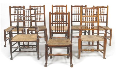 Lot 1591 - A Harlequin Set of Eight Ash and Rush Seated Dining Chairs, North West Region, with double...