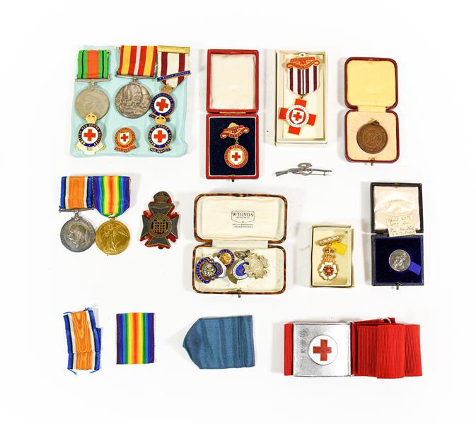 Lot 14 - A First/Second World War Group of Family Medals and Badges, comprising a British War Medal and...