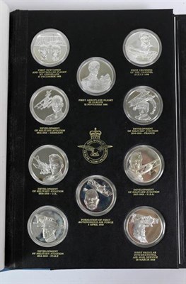 Lot 18 - THE HISTORY OF MAN IN FLIGHT, a set of fifty silver medallions each depicting a famous event within
